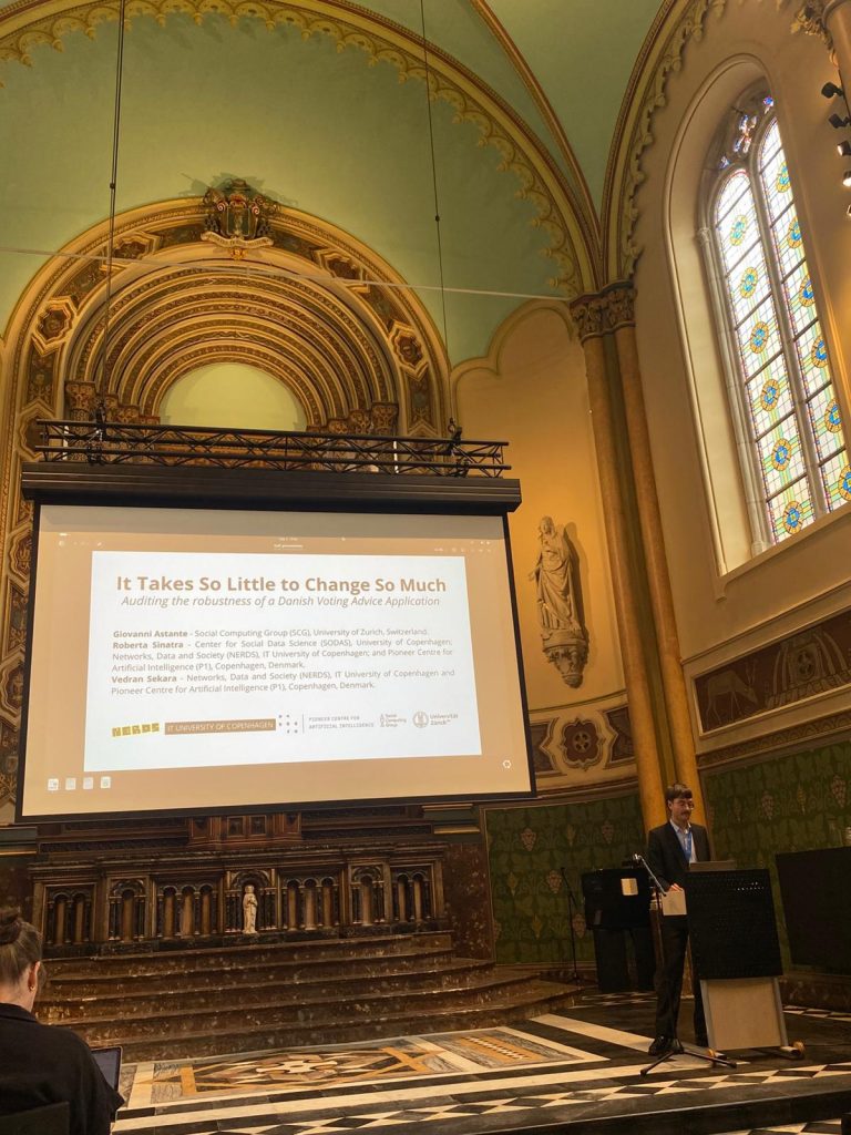 Giovanni Astante presenting our work at ECAF 2026, in a fantastic auditorium